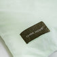 ljusgrön-sängkläder-produktbild-chimi-home-örngott-närbild-logga-rainbow-collection